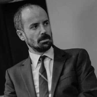 Black and white photo of Emre Kizilkaya