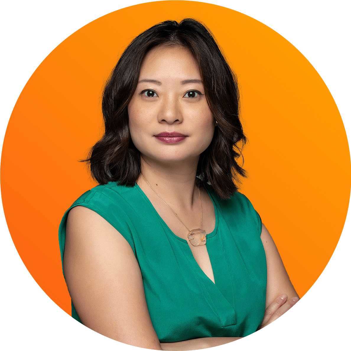 Cutout of Melissa Chan with her arms crossed over color background